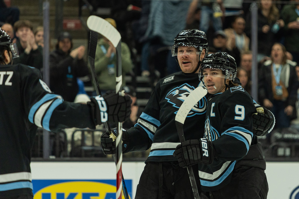 Utah Mammoth center Clayton Keller (9) and left wing Lawson Crouse (67) celebrate the goal against the Ottawa Senators during the first period of an NHL hockey game Wednesday, Jan. 7, 2026, in Salt Lake City. (AP Photo/Melissa Majchrzak)