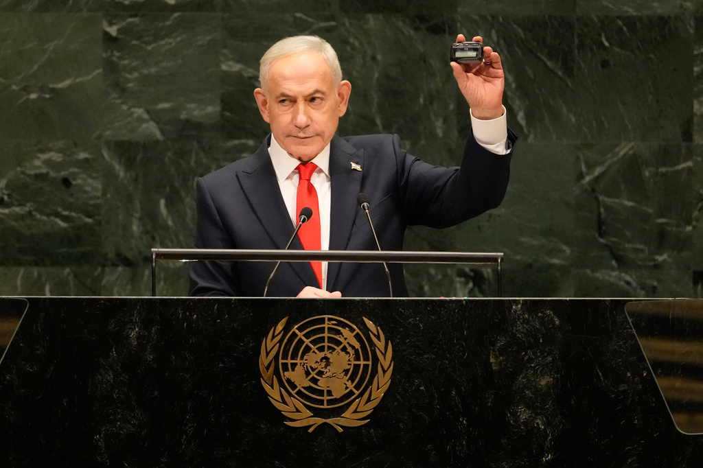 Israeli Prime Minister Benjamin Netanyahu holds a device as he speaks speaks during the 81st session of the United Nations General Assembly at United Nations headquarters, Thursday, Sept. 24, 2026. (AP Photo/Seth Wenig)