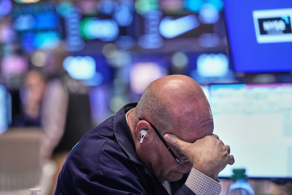 Trader Anthony Confusione works on the floor of the New York Stock Exchange, Thursday, Jan. 8, 2026. (AP Photo/Richard Drew)
