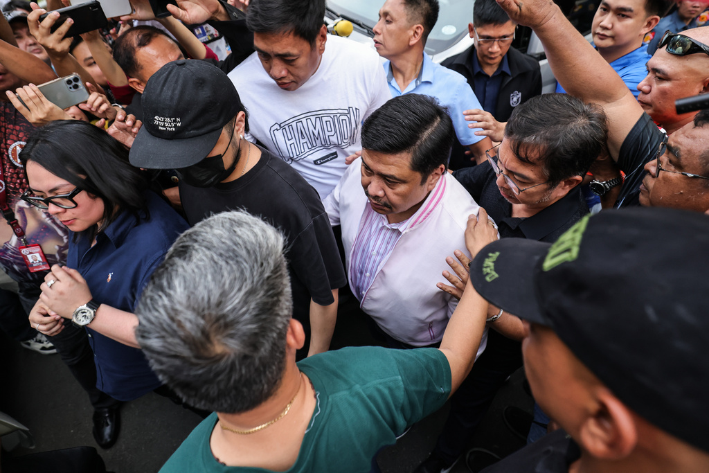 Senator Jose Pimentel "Jinggoy" Estrada, center, leaves the Sandiganbayan Anti-Graft Court in Quezon City, Metro Manila, Friday, May 29, 2026, after posting bail in connection with his graft case. (AP Photo/Gerard Carreon)