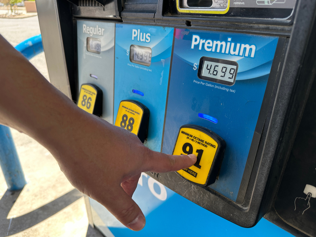 A customer opts for premium grade fuel at a tribally owned gas station near Sandia Pueblo, New Mexico, on Thursday, April 9, 2026. (AP Photo/Susan Montoya Bryan)