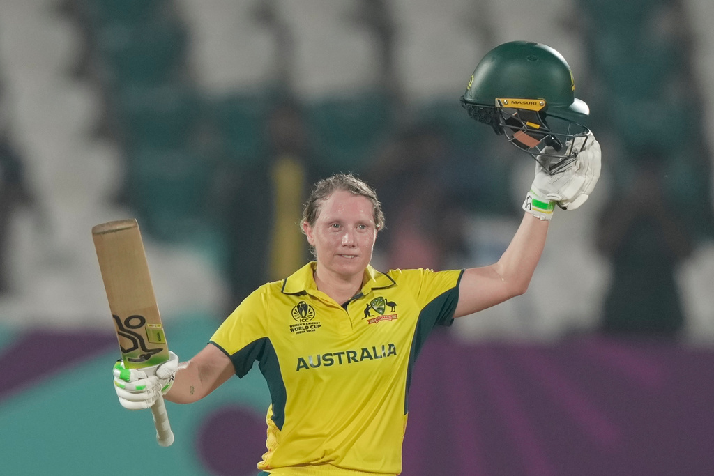 Australia's captain Alyssa Healy celebrates after scoring hundred runs during the ICC Women's Cricket World Cup match between Australia and Bangladesh at ACA–VDCA Cricket Stadium in Visakhapatnam, India, Thursday, Oct. 16, 2025. (AP Photo/Mahesh Kumar A.)