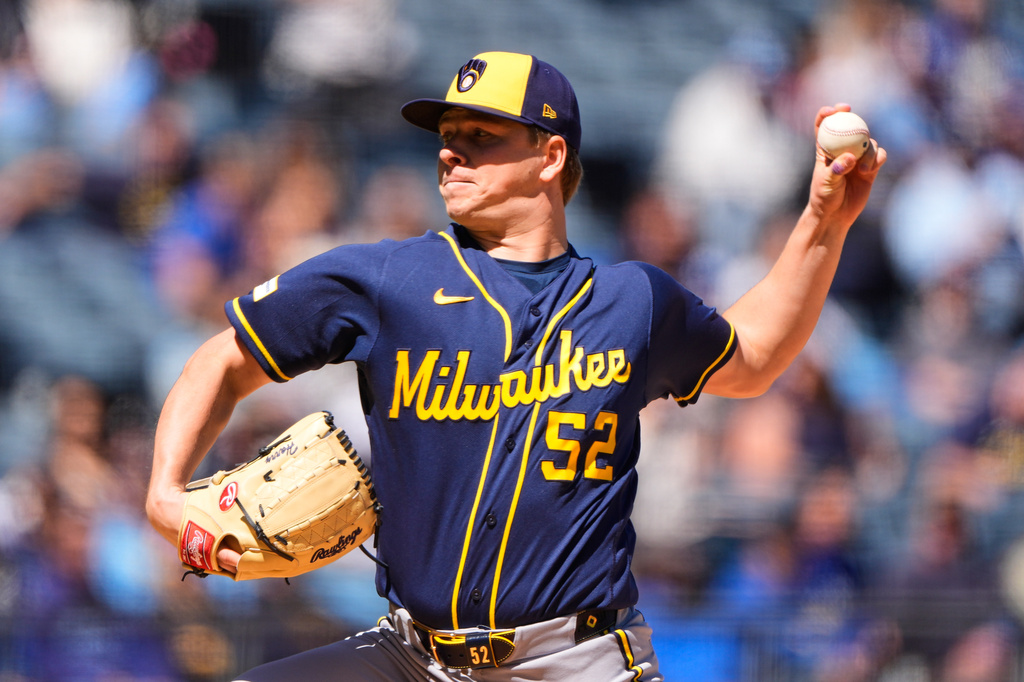 Milwaukee Brewers starting pitcher Kyle Harrison throws during the first inning of a baseball game against the Kansas City Royals, Sunday, April 5, 2026, in Kansas City, Mo. (AP Photo/Charlie Riedel)
