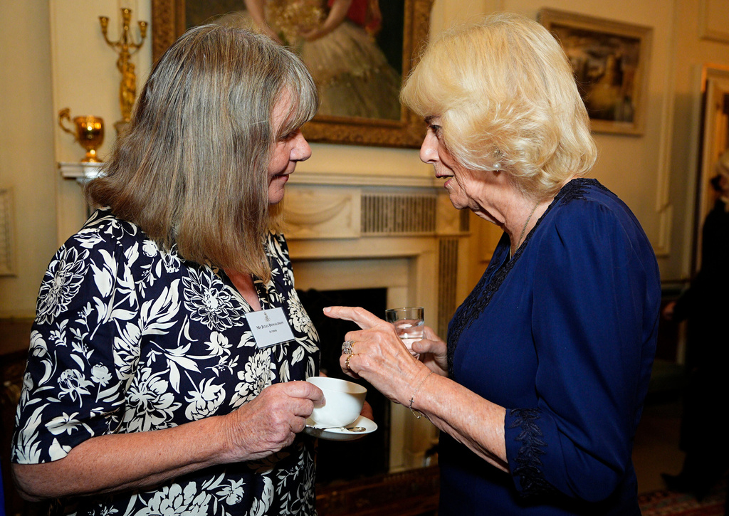 FILE - Queen Camilla, right, speaks with author Julia Donaldson during a reception to celebrate the centenary of BookTrust, at Clarence House, London, Tuesday, Oct. 14, 2025. (Aaron Chown/PA via AP, Pool)