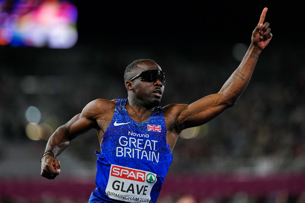 Britain's Romell Glave celebrates winning the gold medal in the men's 100 meters final at the European Athletics Championships in Birmingham, England, Tuesday, Aug. 11, 2026. (AP Photo/Petr David Josek)