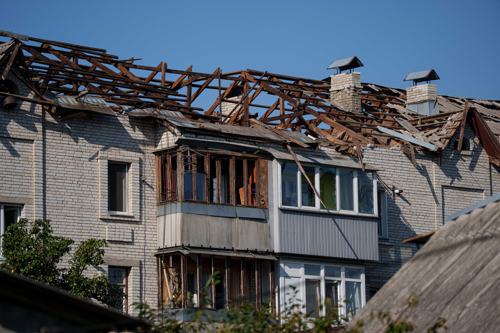 The damaged rooftop of a residential building after a Russian drone strike in Boiarka, Ukraine, Sunday, Sept. 20, 2026. (AP Photo/Evgeniy Maloletka)