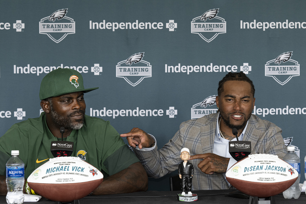 Former Philadelphia Eagles stars Michael Vick, left, and DeSean Jackson address the media at the Eagles' NFL football training camp Tuesday, Aug. 12, 2025, in Philadelphia. Now head coaches at Norfolk State and Delaware State respectively, Vick and Jackson are set to face off in a highly anticipated matchup on Oct. 30 at Lincoln Financial Field. (Jose F. Moreno/The Philadelphia Inquirer via AP)