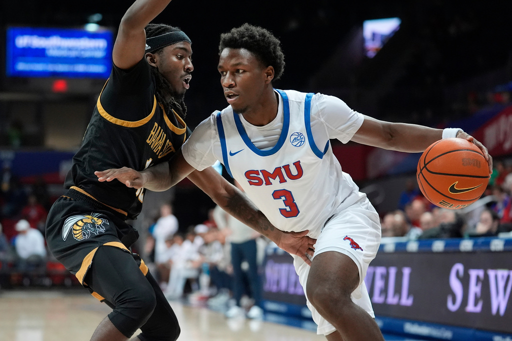 FILE - SMU guard Boopie Miller, right, dribbles against Alabama State guard Shawn Fulcher during the first half of an NCAA college basketball game, Dec. 3, 2024, in Dallas. (AP Photo/LM Otero, File)