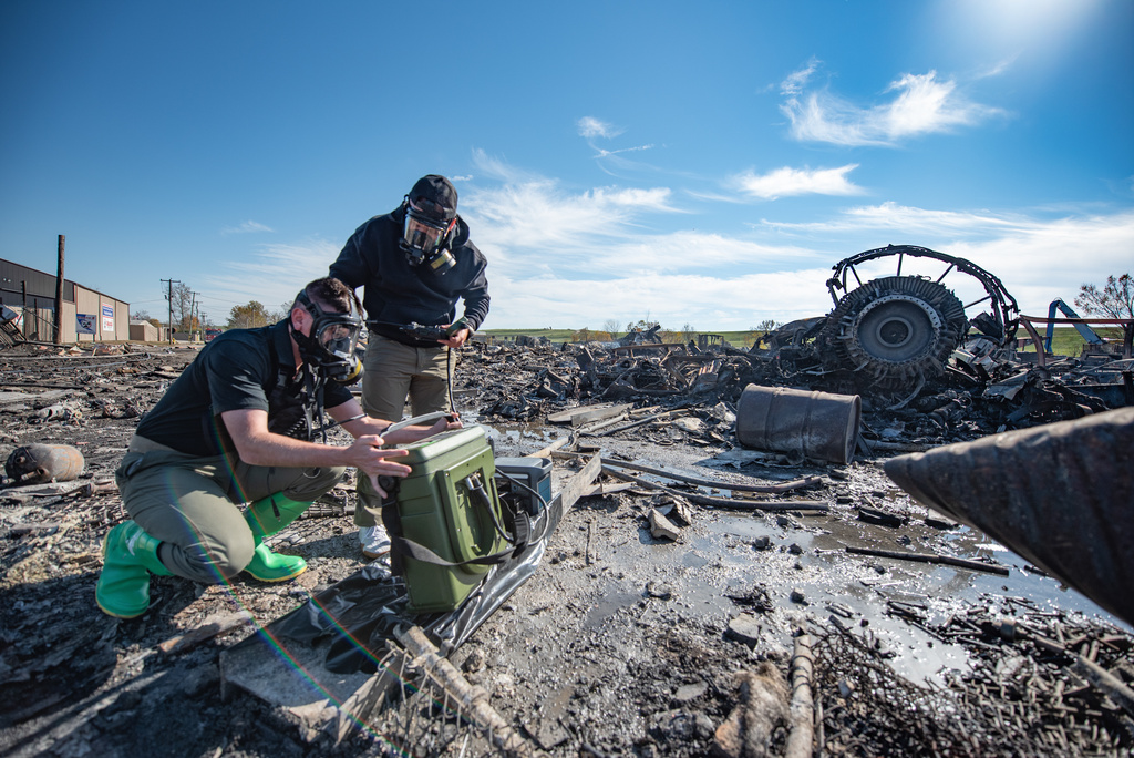 In this photo provided by U.S. Air National Guard, members of the Kentucky National Guard's 41st Civil Support Team use a portable gas chromatograph mass spectrometer at the site of a fatal airplane crash in Louisville, Ky., on Wednesday, Nov. 5, 2025. (Phil Speck/U.S. Air National Guard via AP)