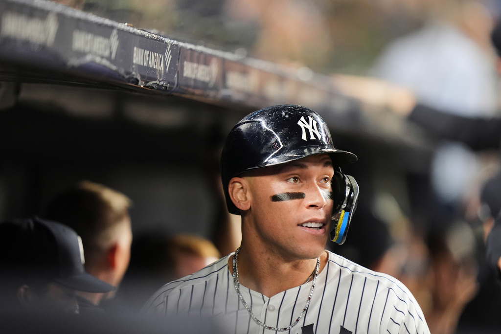 New York Yankees' Aaron Judge looks toward the field as he celebrates with teammates after hitting a three-run home run during the second inning of a baseball game against the Chicago White Sox Wednesday, Sept. 24, 2025, in New York. (AP Photo/Frank Franklin II)