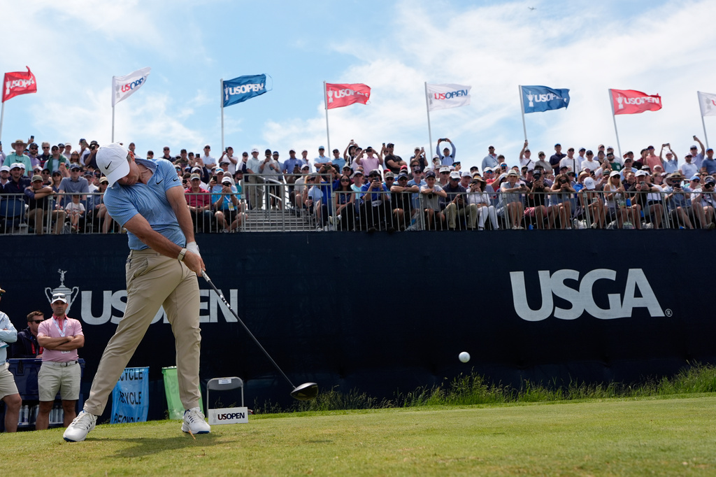 Rory McIlroy, of Northern Ireland, hits his tee shot on the 12th hole during a practice round for the U.S. Open golf tournament at Shinnecock Hills Golf Club in Southampton, N.Y., Wednesday, June 17, 2026.(AP Photo/David J. Phillip)