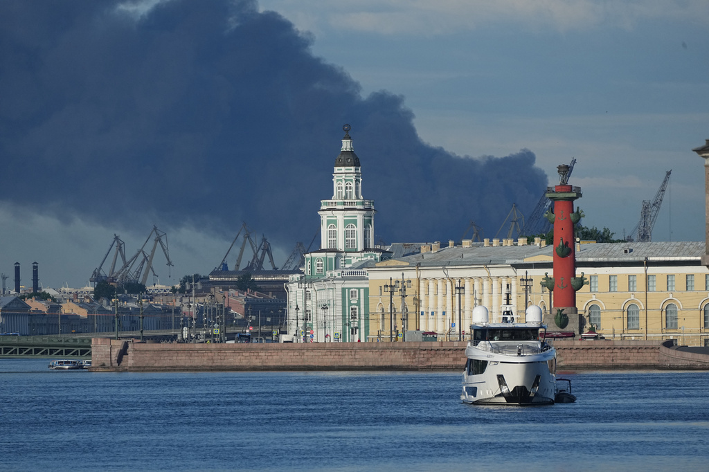 A plumes of black smoke is seen over the port of St. Petersburg, Russia, Wednesday, June 3, 2026, after a Ukrainian drone attack. (AP Photo)