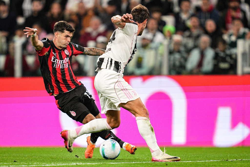 AC Milan's Christian Pulisic, left, and Juventus' Daniele Rugani in action during the Serie A soccer match between Juventus and AC Milan at the Allianz Stadium in Turin, Italy, Sunday Oct. 5, 2025. (Marco Alpozzi/LaPresse via AP)