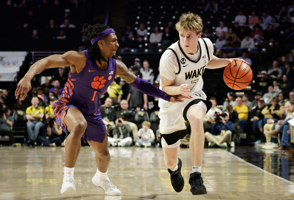 Clemson's Jestin Porter (1) applies pressure to Wake Forest's Isaac Carr (7) in the first half of an ACC men's basketball game, Wednesday, Feb. 18, 2026, in Winston-Salem, N.C. (Allison Lee Isley/The Winston-Salem Journal via AP)