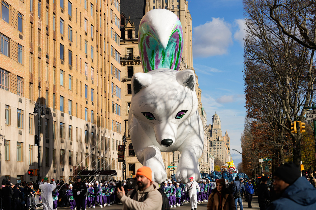 Balloon handlers guide the Noorah balloon down Central Park West during the Macy's Thanksgiving Day Parade, Thursday, Nov. 27, 2025, in New York. (AP Photo/Frank Franklin)