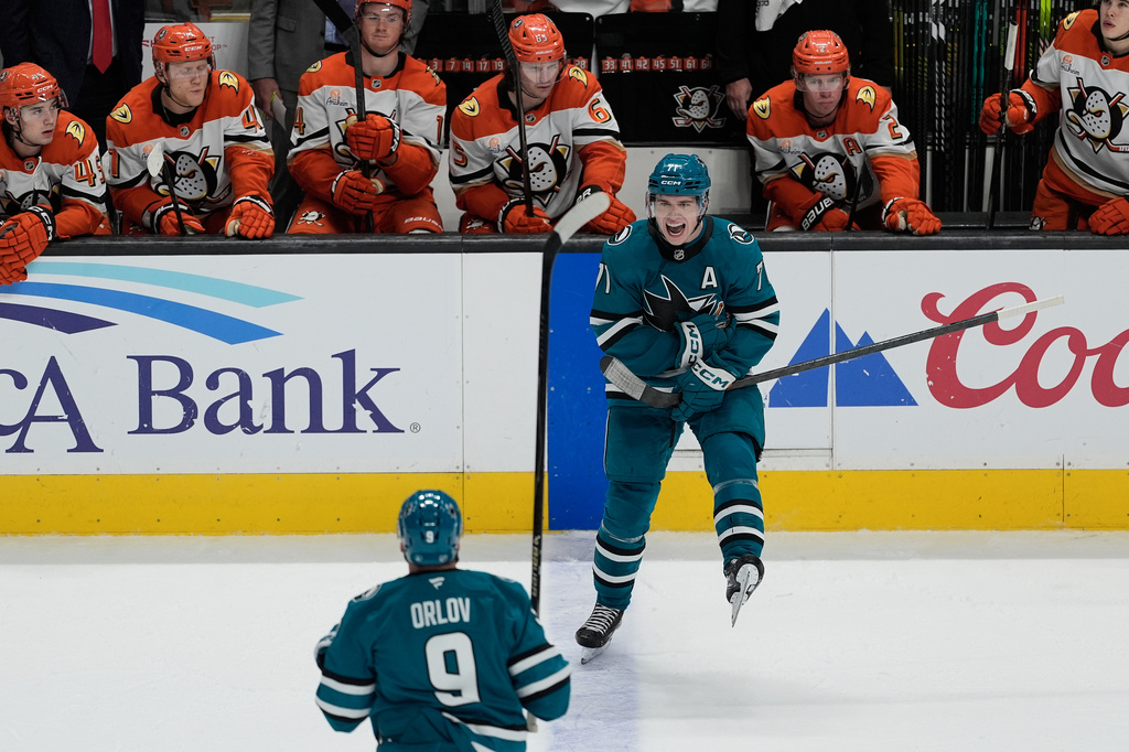 San Jose Sharks center Macklin Celebrini (71) celebrates with defenseman Dmitry Orlov (9) after scoring against the Anaheim Ducks during the third period of an NHL hockey game in San Jose, Calif., Wednesday, April 1, 2026. (AP Photo/Jeff Chiu)