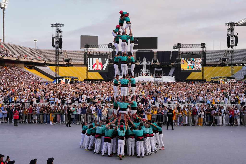 Performers make a human tower, known as Castells, for Pope Leo XIV as he leads a vigil of prayer at the Lluis Companys Olympic Stadium, in Barcelona, Tuesday, June 9, 2026. (AP Photo/Alessandra Tarantino)