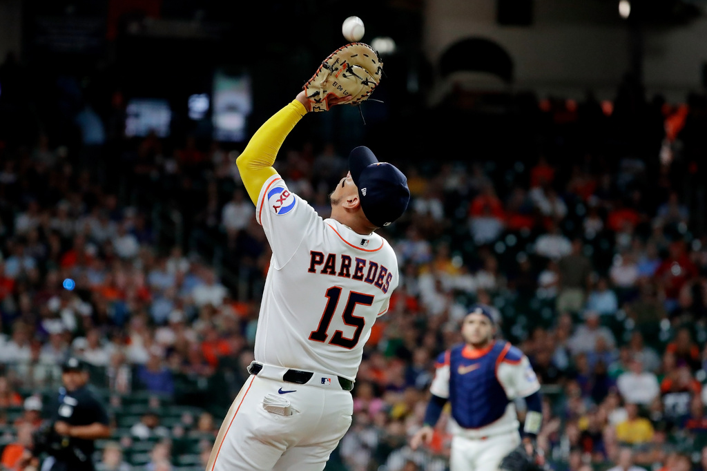 Houston Astros first baseman Isaac Paredes (15) makes the foul territory catch for the out on the pop fly by Detroit Tigers' Wenceel Perez as Astros catcher Yainer Diaz, right, looks on during the ninth inning of a baseball game Tuesday, June 16, 2026, in Houston. (AP Photo/Michael Wyke)