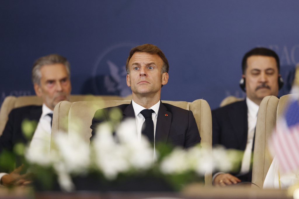 French President Emmanuel Macron looks on during the signature ceremony at the Gaza International Peace Summit, in Sharm el-Sheikh, Egypt, Monday, Oct.13 2025. (Yoan Valat, Pool photo via AP)
