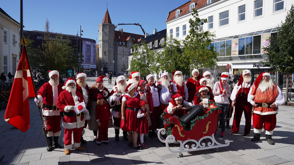 Santas, Mrs. Clauses and Christmas elves from around the world pose for a photo at the annual World Santa Claus Congress, a colorful midsummer tradition, in Aalborg, Denmark, Wednesday July 8, 2026. (AP Photo/James Brooks)
