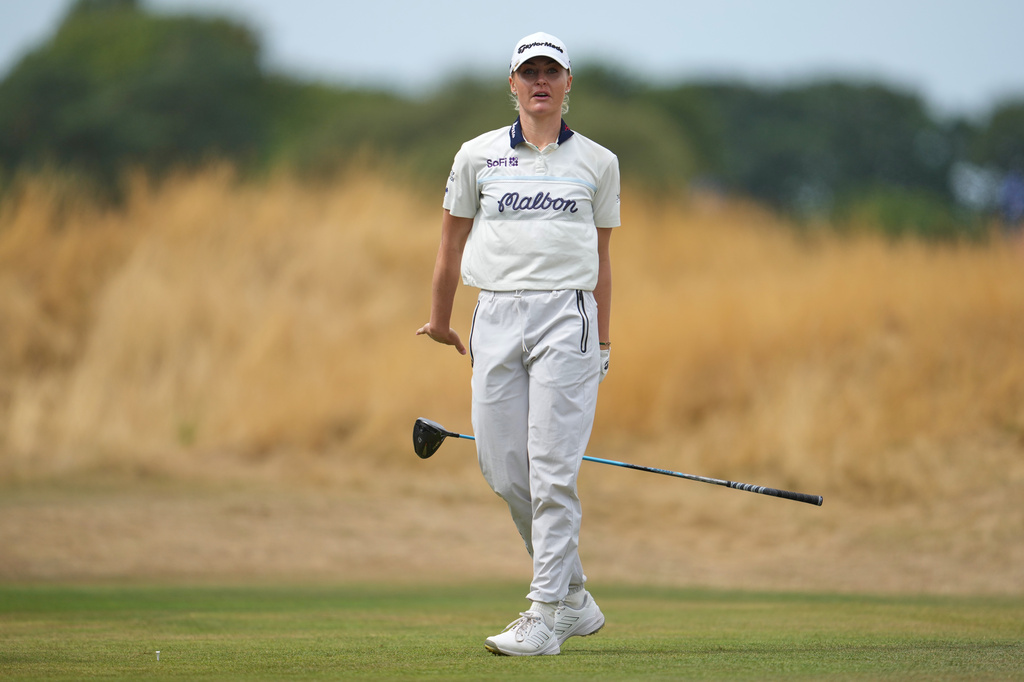 Charley Hull, of England, drops her club after driving off the 3rd tee during the fourth round of the Women's British Open golf championship in Lytham St Annes, England, Sunday, Aug. 2, 2026. (AP Photo/Jon Super)