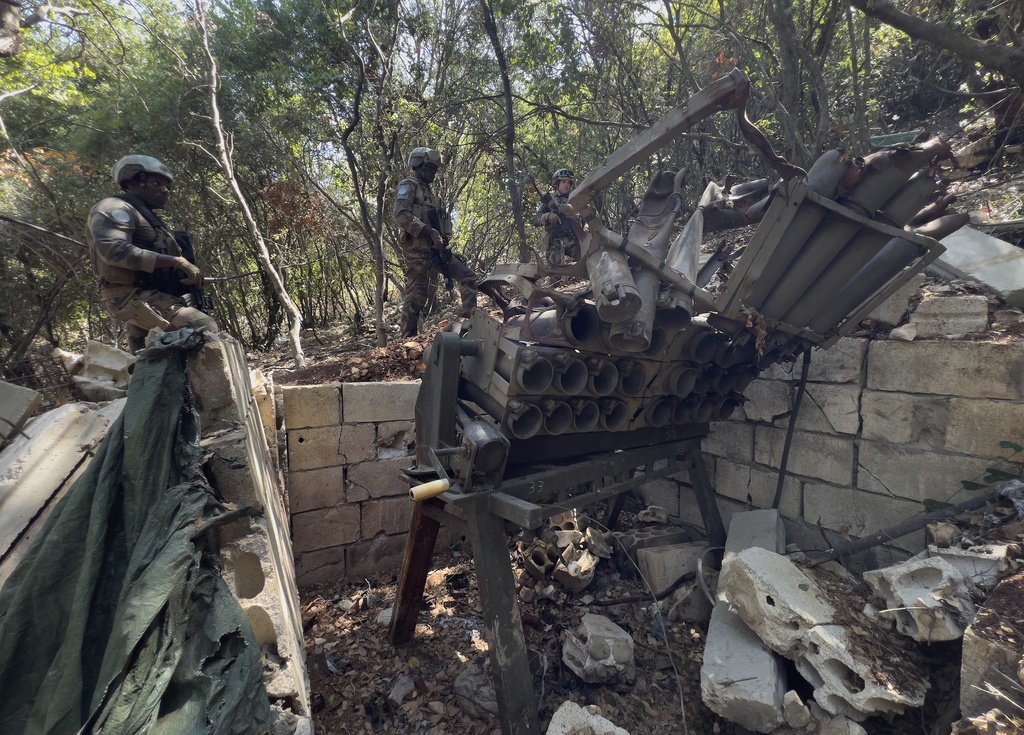 French U.N. peacekeepers inspect a destroyed Hezbollah position in the Saluki Valley, southern Lebanon, Wednesday, Aug. 20, 2025. (AP Photo/Hussein Malla)