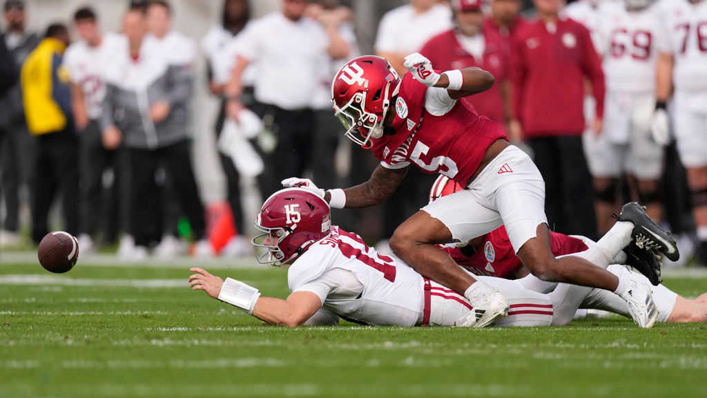 Alabama quarterback Ty Simpson, left, fumbles as he is hit by Indiana defensive back D'Angelo Ponds (5) during the first half of the Rose Bowl College Football Playoff quarterfinal game Thursday, Jan. 1, 2026, in Pasadena, Calif. (AP Photo/Mark J. Terrill)