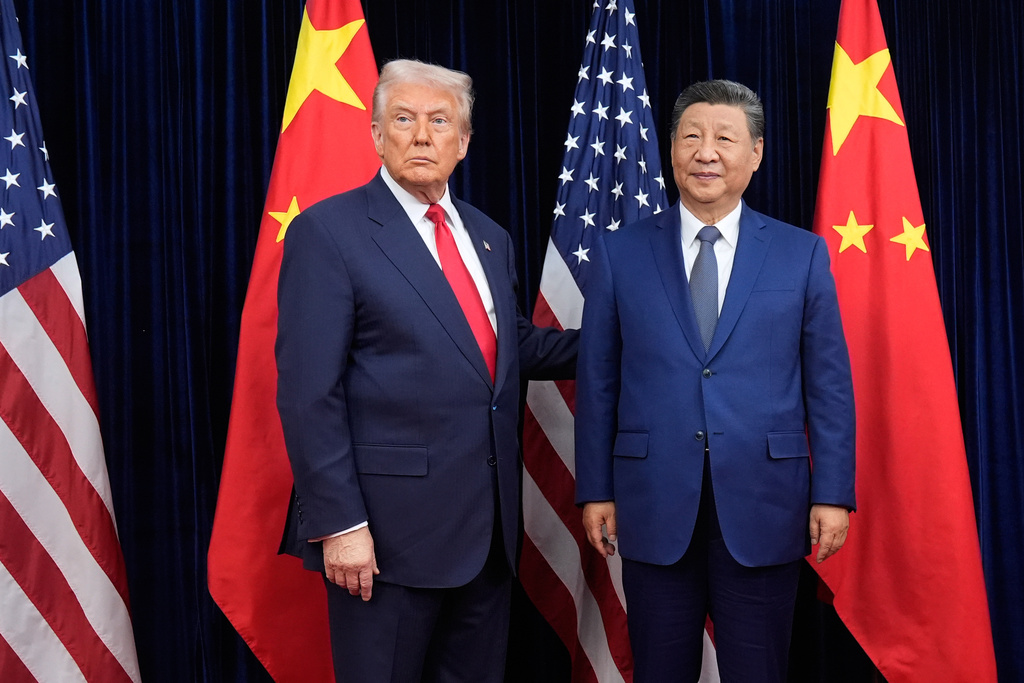 FILE - President Donald Trump, left, and Chinese President Xi Jinping pose ahead of their summit talk at Gimhae International Airport in Busan, South Korea, Oct. 30, 2025. (AP Photo/Mark Schiefelbein, File