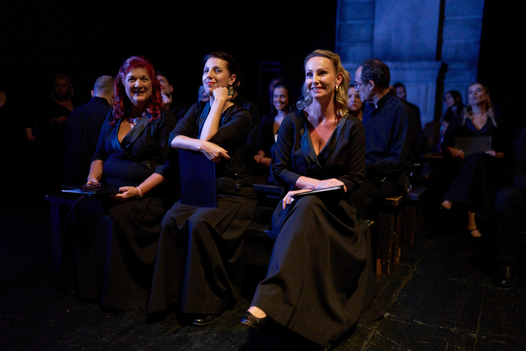 From left to right, Greek mezzo-soprano Zoe Apiranthitou, Greek Soprano, Eleni Koutsoubi and German mezzo-soprano Barunka Preisinger, wait at the stage before their performance at the International Opera Awards, held at the Greek National Opera, in Athens, Thursday, Nov. 13, 2025. (AP Photo/Petros Giannakouris)