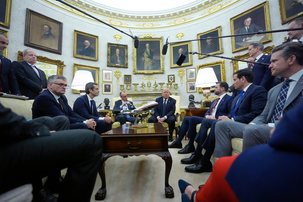 President Donald Trump meets with German Chancellor Friedrich Merz in the Oval Office at the White House, Tuesday, March 3, 2026, in Washington. (AP Photo/Mark Schiefelbein)