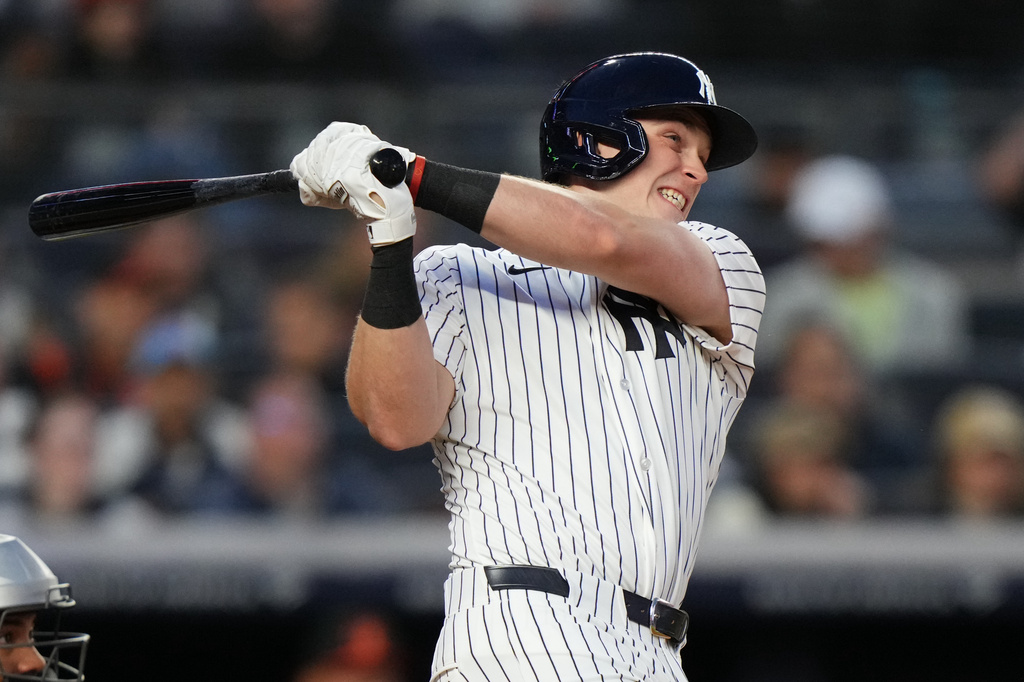 New York Yankees' Ben Rice follows through on a three-run home run during the second inning of a baseball game against the Baltimore Orioles Friday, May 1, 2026, in New York. (AP Photo/Frank Franklin II)