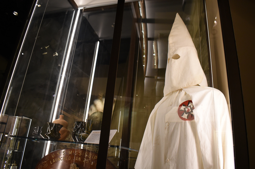 A Ku Klux Klan mask stares out over the Mississippi Museum of History on Friday, March 27, 2026, in Jackson, Miss. (AP Photo/Sophie Bates)