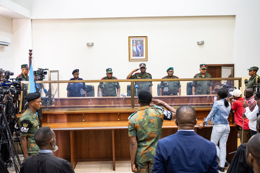 Military officers stand in the dock during the trial of former Congolese President Joseph Kabila in Kinshasa, Democratic Republic of Congo, Tuesday, Sept. 30, 2025 (AP Photo/ Samy Ntumba Shambuyi) Military officers stand in the dock during the trial of former Congolese President Joseph Kabila in Kinshasa, Democratic Republic of Congo, Tuesday, Sept. 30, 2025 (AP Photo/ Samy Ntumba Shambuyi)