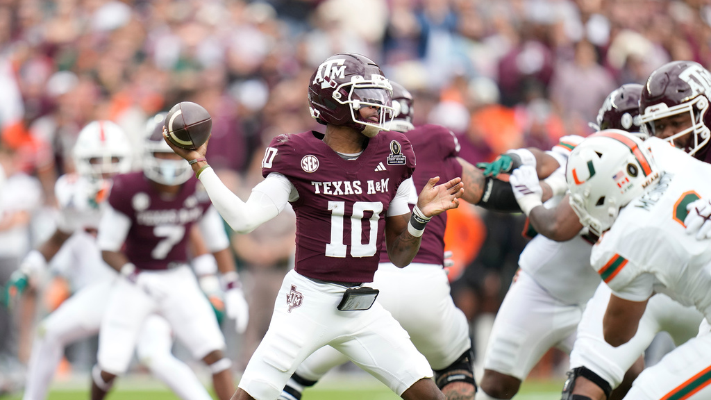 FILE - Texas A&amp;M quarterback Marcel Reed (10) drops back to pass against Miami during the first half of the first round of the College Football Playoff, Saturday, Dec. 20, 2025, in College Station, Texas. (AP Photo/Karen Warren,File)
