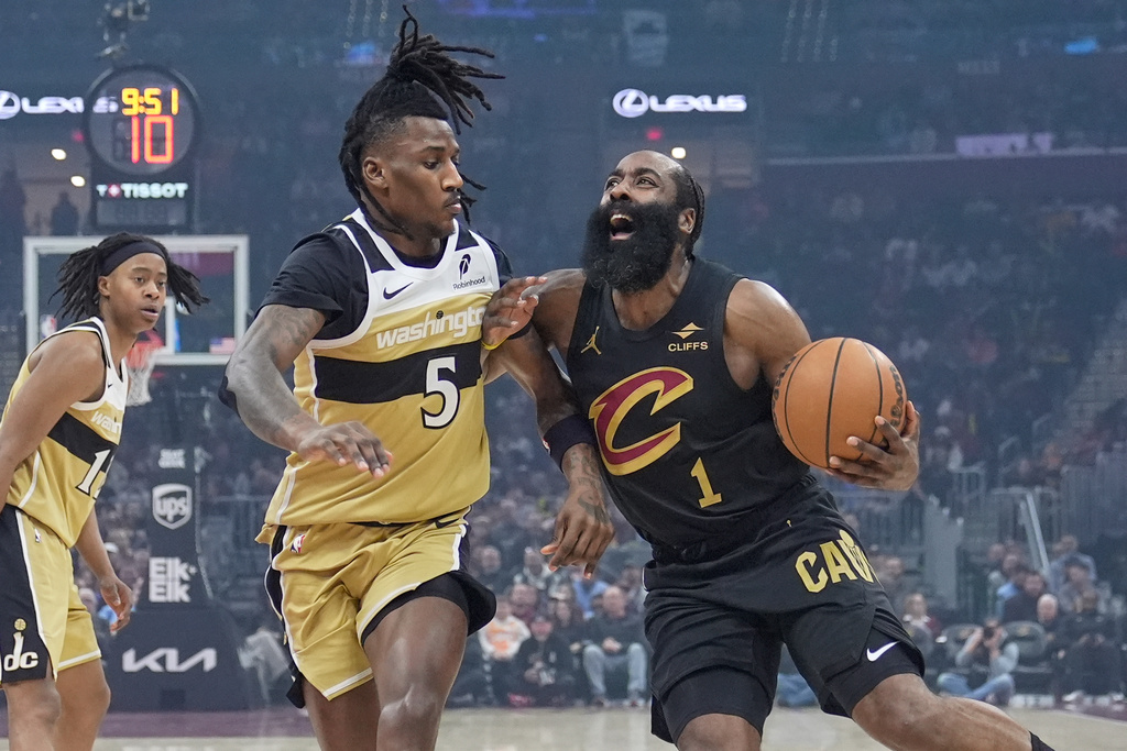 Cleveland Cavaliers guard James Harden (1) drives against Washington Wizards guard Jamir Watkins (5) in the first half of an NBA basketball game in Cleveland, Wednesday, Feb. 11, 2026. (AP Photo/Sue Ogrocki)
