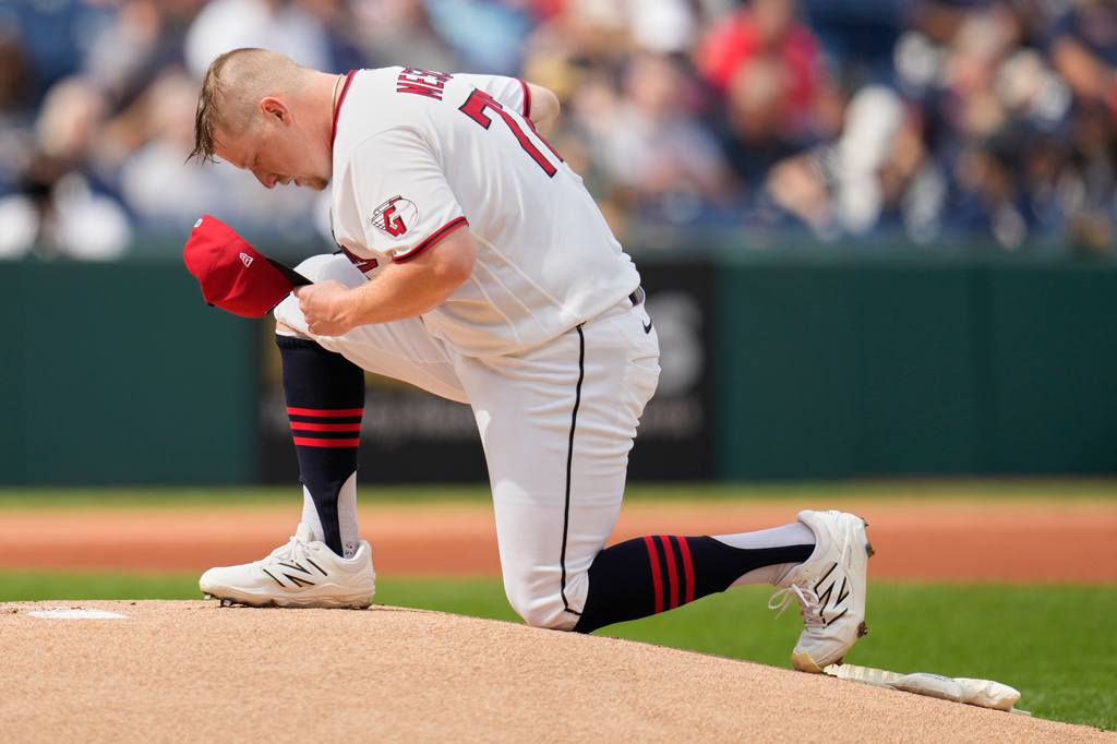 Cleveland Guardians' Parker Messick kneels on the pitching mound before a baseball game against the Chicago White Sox in Cleveland, Wednesday, Sept. 16, 2026. (AP Photo/Sue Ogrocki)