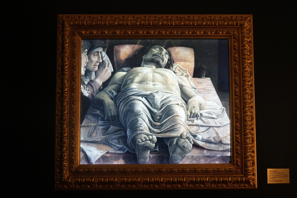 A high-definition, digital version of Andrea Mantegna's painting, "Cristo Morto nel Sepolcro e Tre Dolenti (The Lamentation Over the Dead Christ)," hangs at the Brera Art Gallery in Milan, Italy, Monday, Nov. 24, 2025. (Courtesy of Save the Artistic Heritage/Brera Art Gallery via AP)