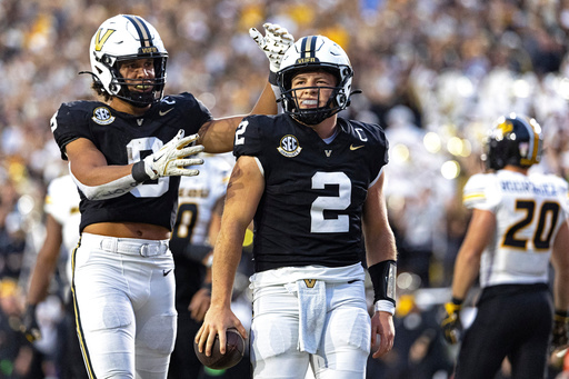 Vanderbilt quarterback Diego Pavia (2) celebrates with tight end Eli Stowers after scoring a touchdown during the second half of an NCAA college football game against Missouri, Saturday, Oct. 25, 2025, in Nashville, Tenn. (AP Photo/Wade Payne) Vanderbilt quarterback Diego Pavia (2) celebrates with tight end Eli Stowers after scoring a touchdown during the second half of an NCAA college football game against Missouri, Saturday, Oct. 25, 2025, in Nashville, Tenn. (AP Photo/Wade Payne)