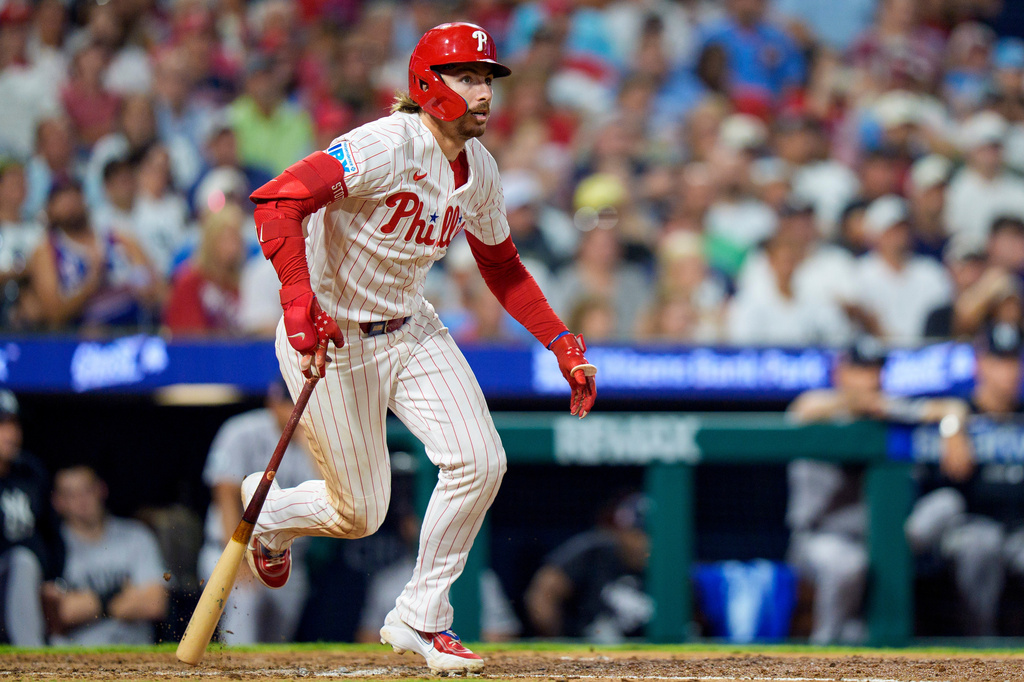 Philadelphia Phillies' Bryson Stott watches his three-run double during the sixth inning of a baseball game against the New York Yankees, Sunday, July 26, 2026, in Philadelphia. (AP Photo/Chris Szagola)