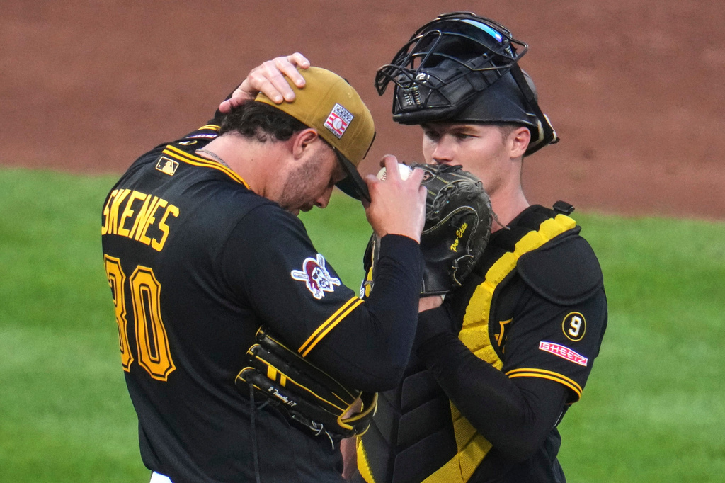 Pittsburgh Pirates pitcher Paul Skenes, left, and catcher Henry Davis, right, talk on the mound during the fifth inning of a baseball game against the Chicago Cubs in Pittsburgh, Saturday, July 25, 2026. (AP Photo/Gene J. Puskar)
