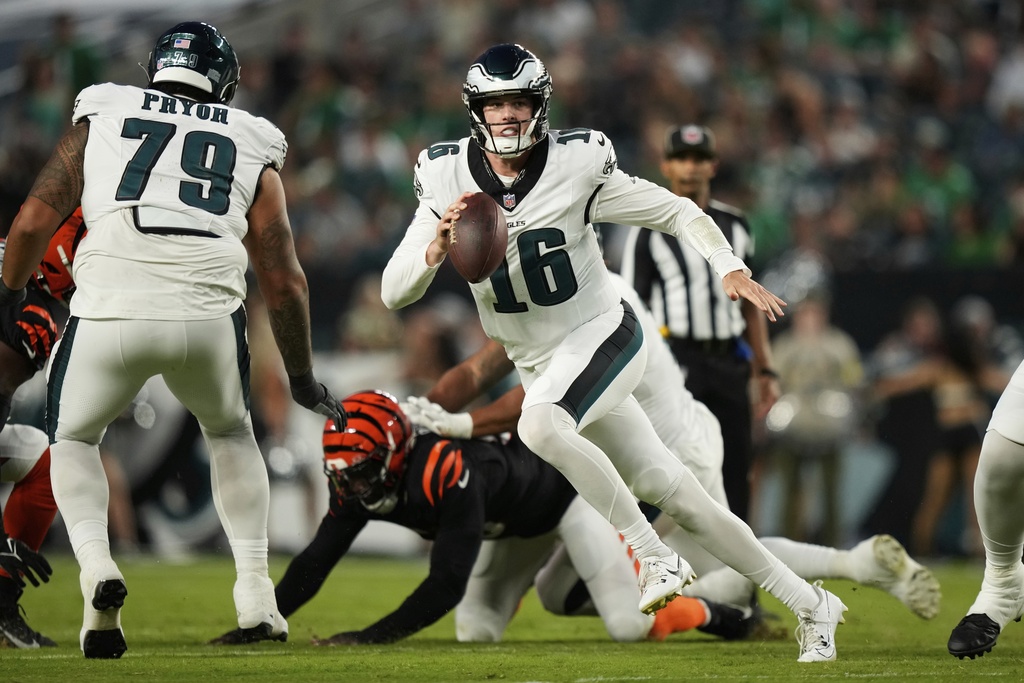 Philadelphia Eagles quarterback Tanner McKee (16) runs with the ball during the first half of an NFL preseason football game against the Cincinnati Bengals on Thursday, Aug. 7, 2025, in Philadelphia. (AP Photo/Matt Slocum)