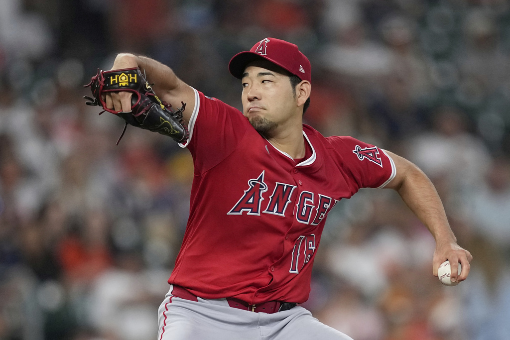 Los Angeles Angels starting pitcher Yusei Kikuchi throws against the Houston Astros during the first inning of a baseball game Monday, Sept. 1, 2025, in Houston. (AP Photo/David J. Phillip)