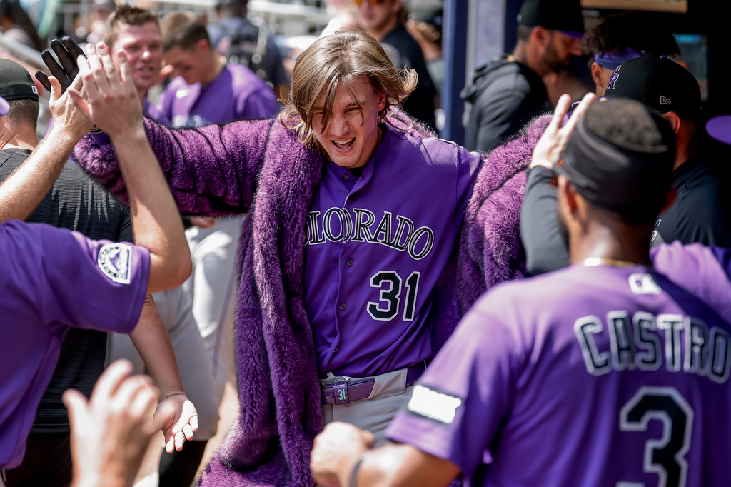 Colorado Rockies' Jake McCarthy (31) celebrates in the dugout after hitting a solo home run against the Atlanta Braves during the sixth inning of a baseball game, Sunday, Aug. 30, 2026, in Atlanta. (AP Photo/Erik S. Lesser)