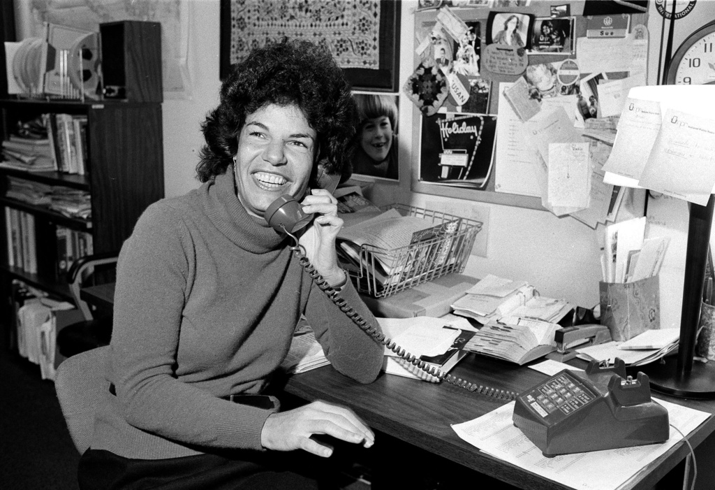 FILE - National Public Radio staffer Susan Stamberg holds a phone in her Washington D.C. office, Oct. 13, 1979. (AP Photo/Barry Thumma, File)