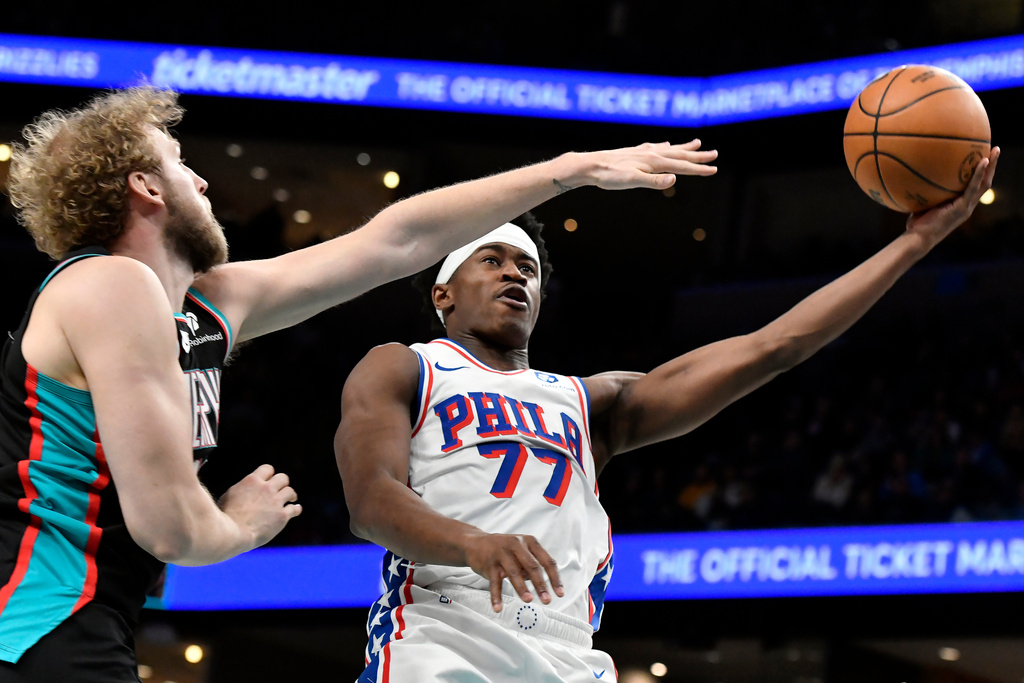Philadelphia 76ers guard VJ Edgecombe (77) shoots against Memphis Grizzlies center Jock Landale in the second half of an NBA basketball game Tuesday, Dec. 30, 2025, in Memphis, Tenn. (AP Photo/Brandon Dill)