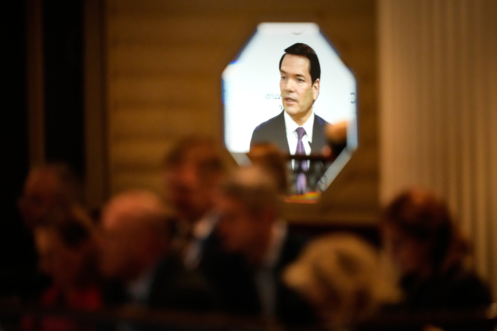 U.S. Secretary of State Marco Rubio is reflected in a mirror while speaking at the Munich Security Conference in Munich, Germany, Saturday, Feb. 14, 2026. (AP Photo/Alex Brandon, Pool)