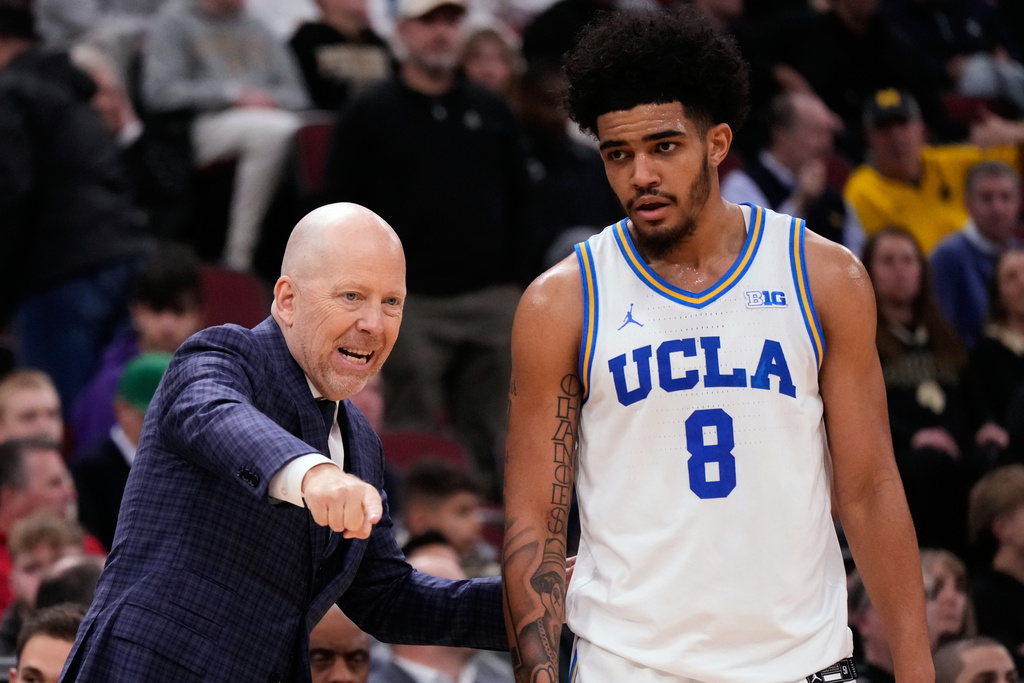 UCLA head coach Mick Cronin, left, directs guard Eric Freeny during the second half of an NCAA college basketball game against Purdue in the semifinals of the Big 10 Conference tournament, Saturday, March 14, 2026, in Chicago. (AP Photo/Nam Y. Huh)