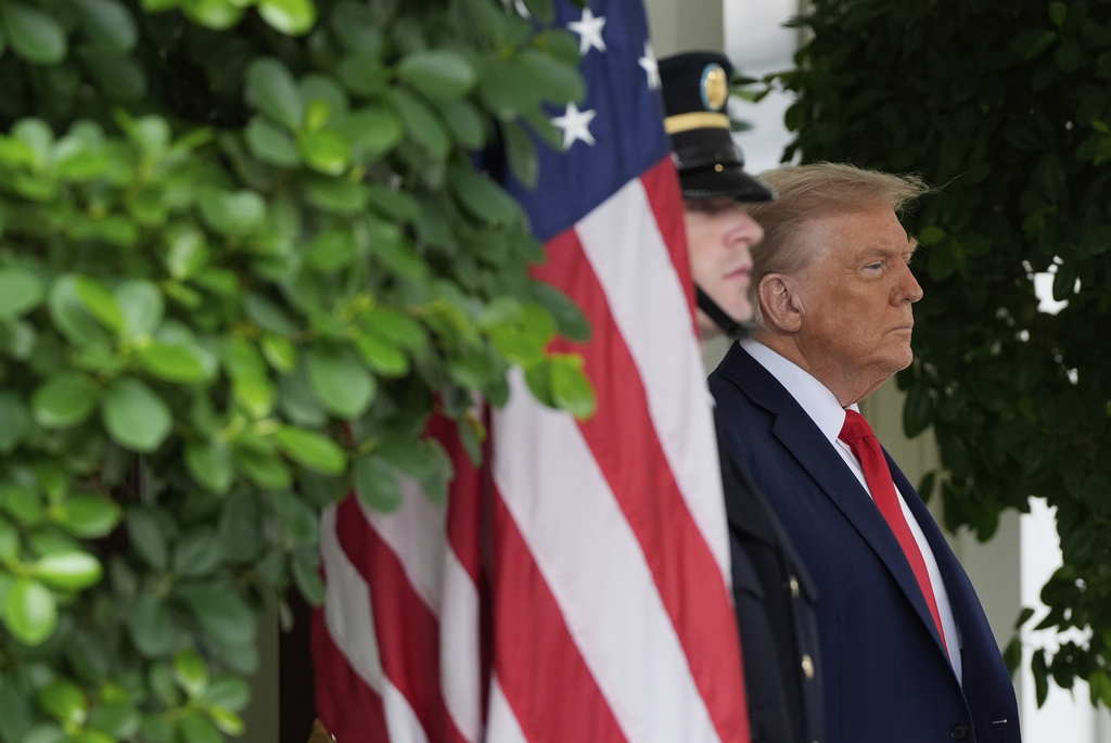 President Donald Trump waits to greet Ukraine's President Volodymyr Zelenskyy at the White House, Monday, Aug. 18, 2025, in Washington. (AP Photo/Julia Demaree Nikhinson)