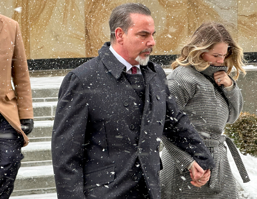 Joseph Bongiovanni, left, leaves federal court with his wife, Lindsay Bongiovanni, after being sentenced to 5 years in prison on corruption charges, Wednesday, Jan. 21, 2026, in Buffalo, N.Y. (AP Photo/Jim Mustian)