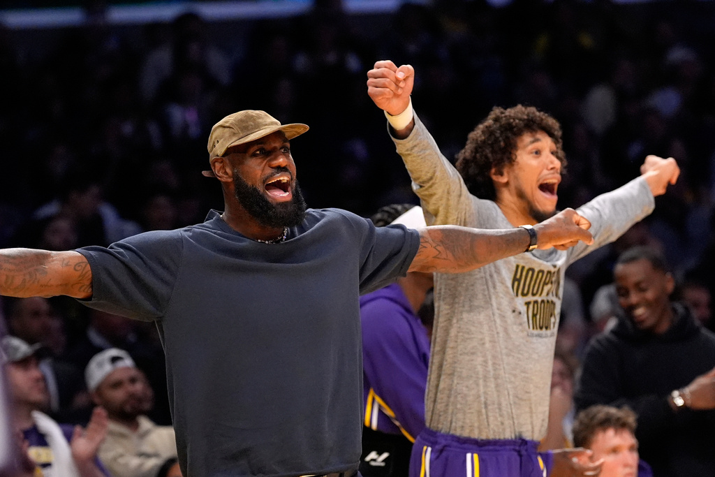Los Angeles Lakers' LeBron James, left, and Jaxson Hayes gesture during the second half of an NBA basketball game against the San Antonio Spurs, Wednesday, Nov. 5, 2025, in Los Angeles. (AP Photo/Mark J. Terrill)